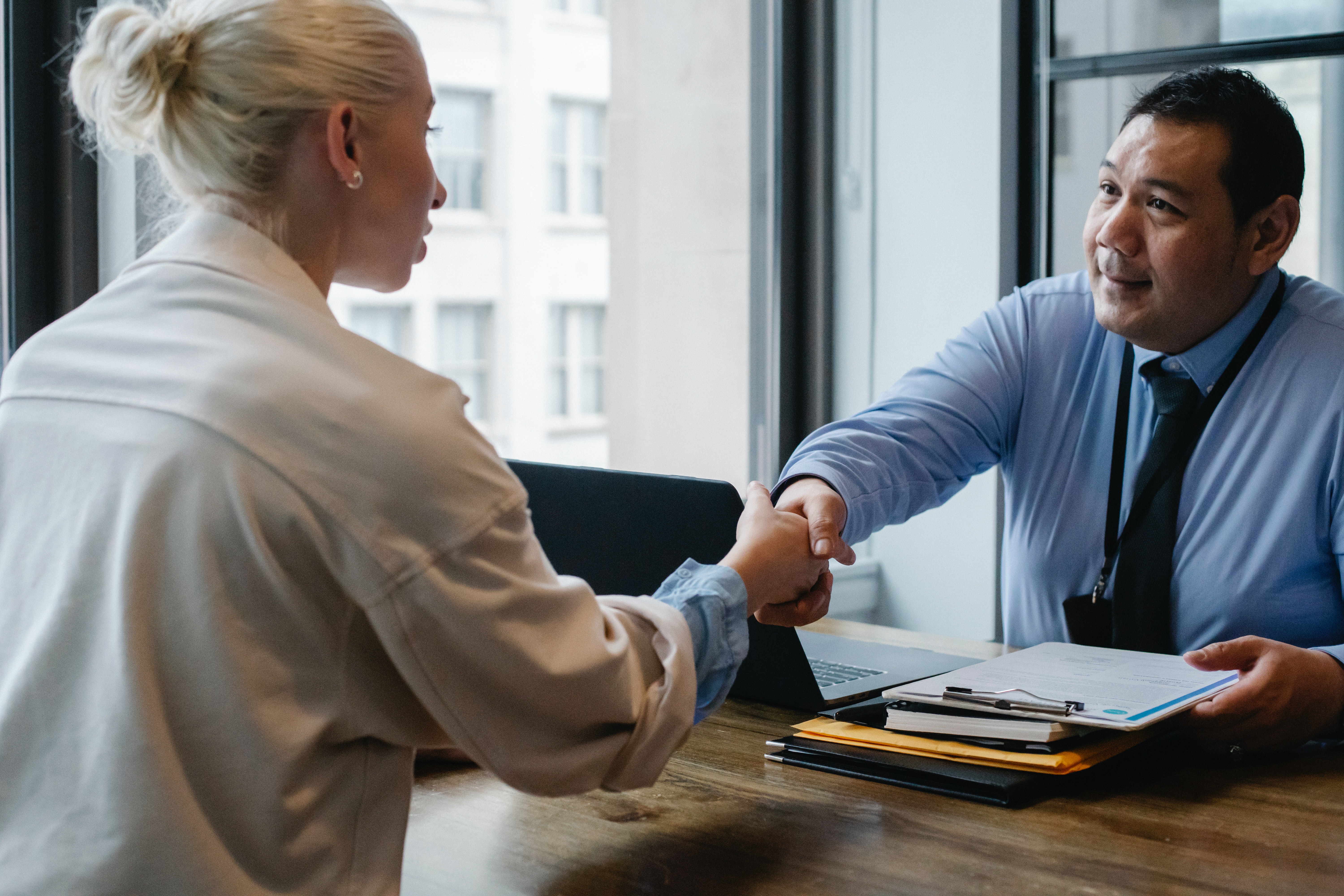 A man shaking hands with a man